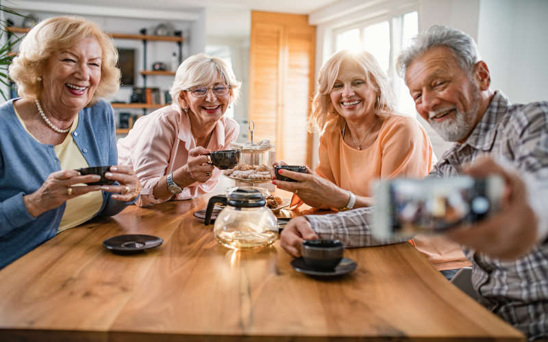 Retiree networking to earn money after 55 with low-risk hustles