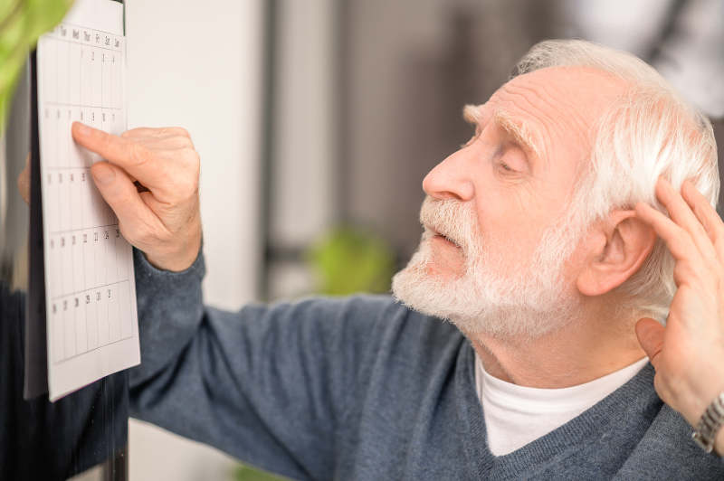 Retiree using calendar for easy side hustles to earn money after 55
